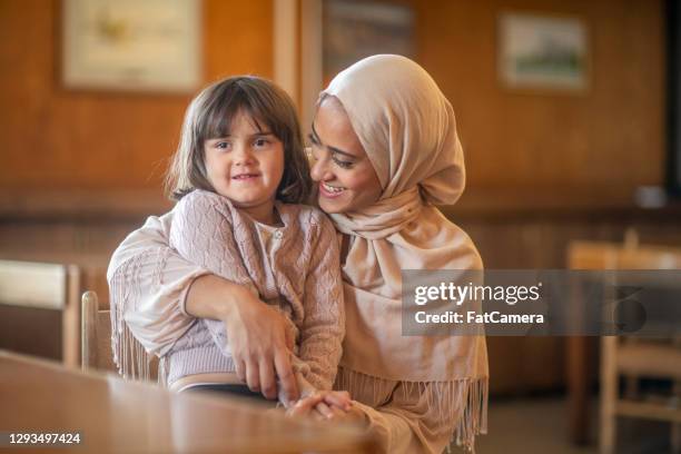 muslim mother and daughter - afghan stock pictures, royalty-free photos & images
