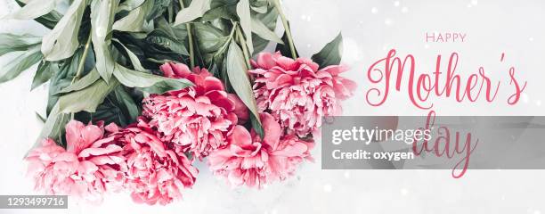 beautiful blooming fresh bunch of pink peonies. happy mother's day text - wedding card background stock pictures, royalty-free photos & images