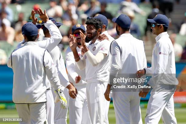 Jasprit Bumrah of India celebrates the dismissal of Pat Cummins of Australia during day four of the Second Test match between Australia and India at...