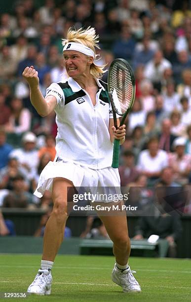 Jana Novotna of the Czech Republic punches the air after beating Venus Williams 7-5, 7-6 in the quarter-finals of the Lawn Tennis Championships at...