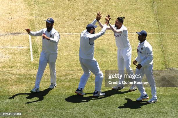 Mohammed Siraj of India celebrates the dismissal of Nathan Lyon of Australia during day four of the Second Test match between Australia and India at...