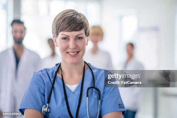 portrait of caucasian female nurse - resident stock pictures, royalty-free photos & images