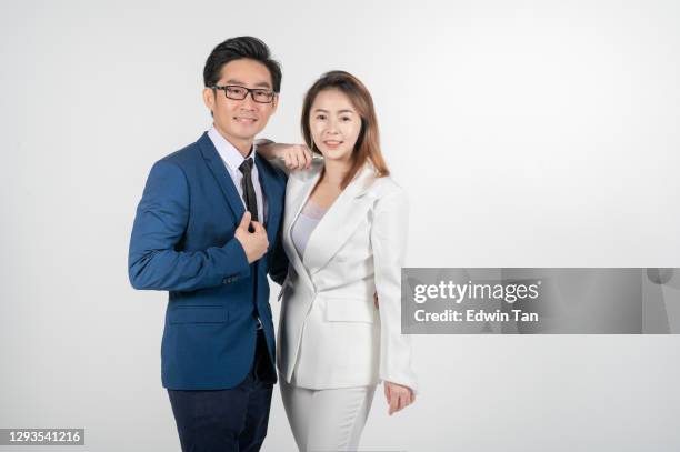 asian chinese businessman and businesswoman couple studio shoot white background cut out - well dressed couple isolated stock pictures, royalty-free photos & images