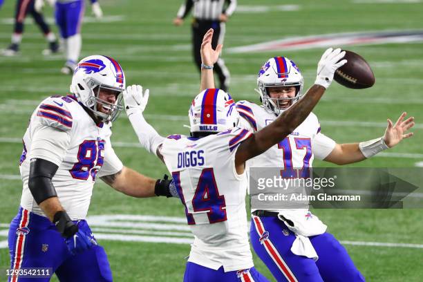 Lee Smith and Josh Allen celebrate with Stefon Diggs of the Buffalo Bills after Diggs' touchdown during the first half against the New England...