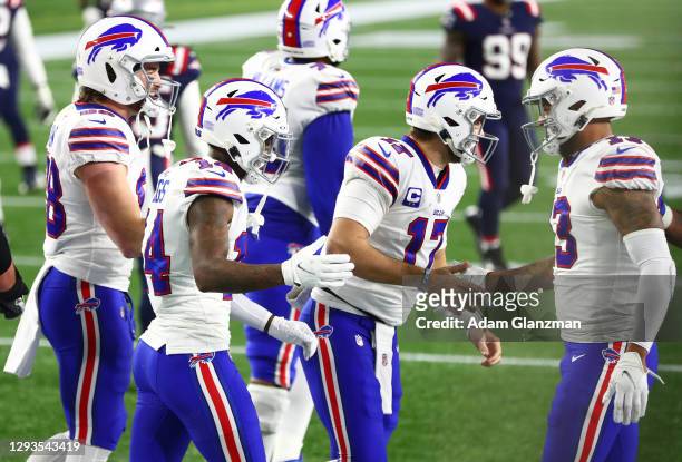 Gabriel Davis high-fives Josh Allen and Stefon Diggs of the Buffalo Bills after Diggs' touchdown during the second half against the New England...