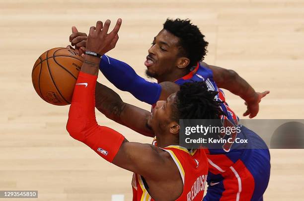 Delon Wright of the Detroit Pistons blocks a shot by Cam Reddish of the Atlanta Hawks during the second half at State Farm Arena on December 28, 2020...