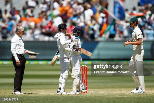 Ajinkya Rahane of India and Shubman Gill of India embrace after winning the Second Test match between Australia and India at Melbourne Cricket Ground...