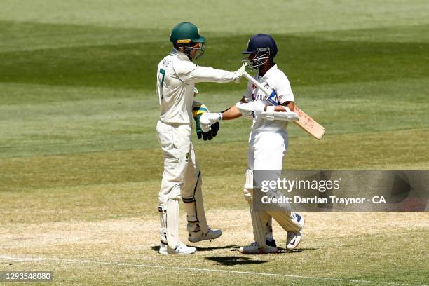 Australian captain Tim Paine and Indian captain Ajinkya Rahane shake hands in the middle of the M.C.G. After Indian won the Second Test match between...