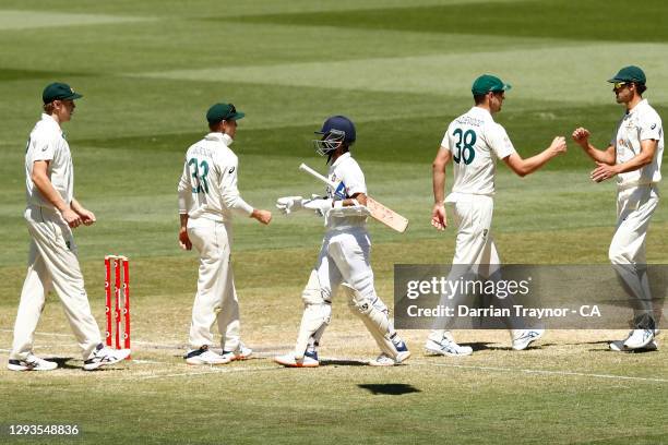 Ajinkya Rahane of India shakes hands with the Australian players during day four of the Second Test match between Australia and India at Melbourne...