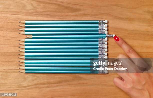 teacher preparing pencils for school day - obsessief stockfoto's en -beelden