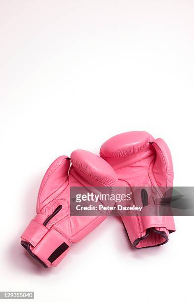 pink woman's boxing gloves - frauenpower stock-fotos und bilder