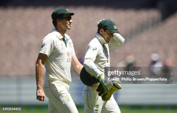 Tim Paine and Pat Cummins of Australia leave the ground after India won the Second Test match between Australia and India at Melbourne Cricket Ground...