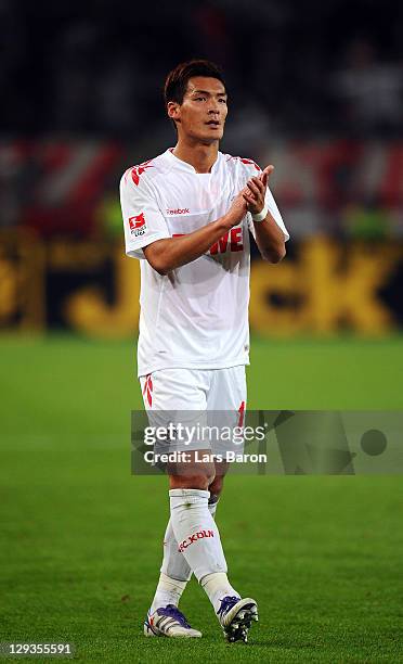 Tomoaki Makino of Koeln celebrates after winning the Bundesliga match between 1. FC Koeln and Hannover 96 at RheinEnergieStadion on October 16, 2011...