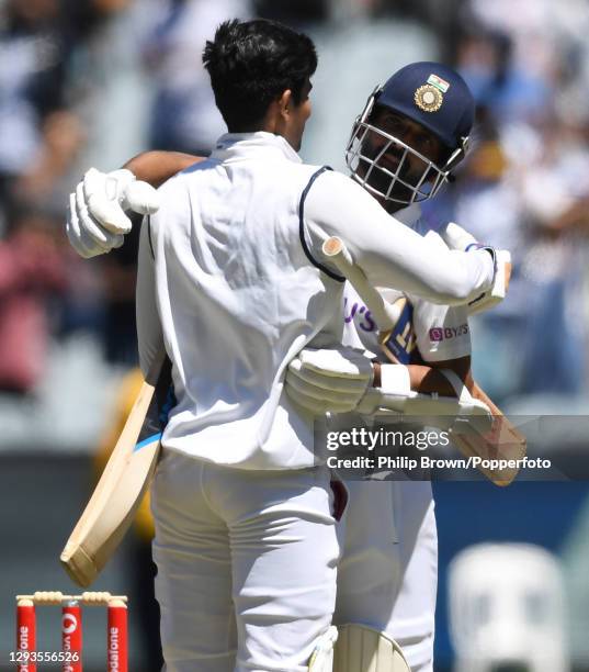 Ajinkya Rahane embraces Shubman Gill after India won the Second Test match between Australia and India at Melbourne Cricket Ground on December 29,...