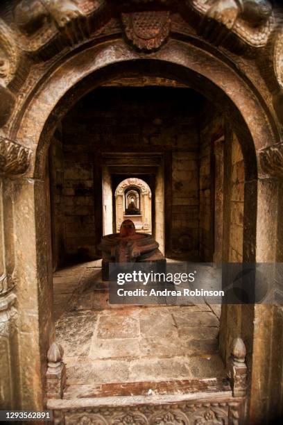 inside view of the small shiva temples with lingums visible in a line in the pandra shivalaya at pashupatinath hindu cremation temple, kathmandu, nepal - pashupatinath stock pictures, royalty-free photos & images