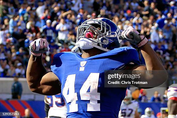 Ahmad Bradshaw of the New York Giants celebrates his touchdown against the Buffalo Bills during the first half at MetLife Stadium on October 16, 2011...