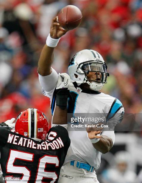 Sean Weatherspoon of the Atlanta Falcons forces a fumble by Cam Newton of the Carolina Panthers at Georgia Dome on October 16, 2011 in Atlanta,...