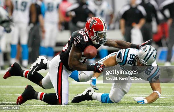 William Moore of the Atlanta Falcons breaks up a pass intended for Greg Olsen of the Carolina Panthers at Georgia Dome on October 16, 2011 in...