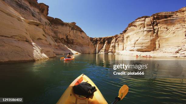 pov kayaking in canyons of powell lake recreational area - lake powell stock pictures, royalty-free photos & images