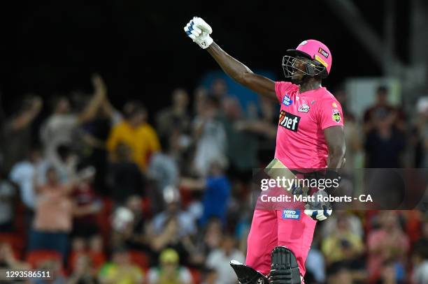 Jason Holder of the Sixers celebrates winning the Big Bash League match between the Melbourne Renegades and the Sydney Sixers at Metricon Stadium, on...