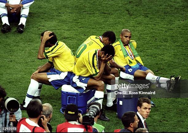 Edmundo, Rivaldo, Cafu and Roberto Carlos of Brazil hang their heads in despair after losing the World Cup Final against France at the Stade de...