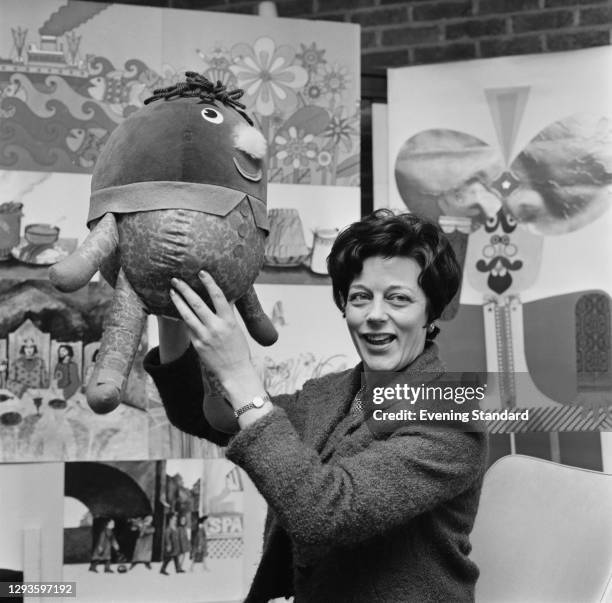 Monica Sims , Head of Children's Programmes at BBC Television, holding the soft toy Humpty from the show 'Play School', UK, February 1968.