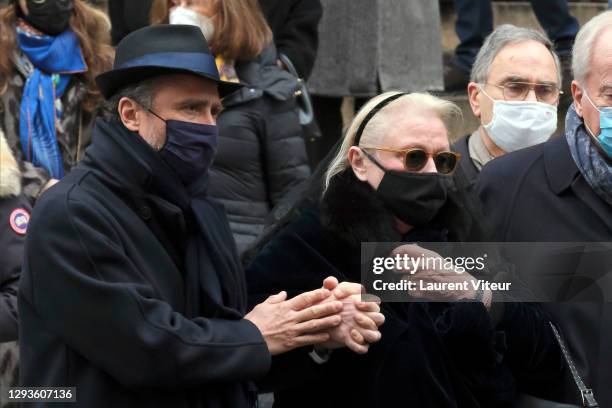 Alaxandre Brasseur and his mother Michele Cambon attend actor Claude Brasseur's funeral in Saint Roch Church on December 29, 2020 in Paris, France.