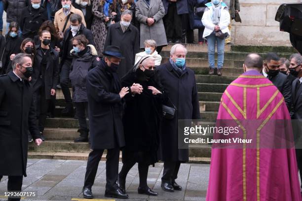 Alaxandre Brasseur and his mother Michele Cambon attend actor Claude Brasseur's funeral in Saint Roch Church on December 29, 2020 in Paris, France.