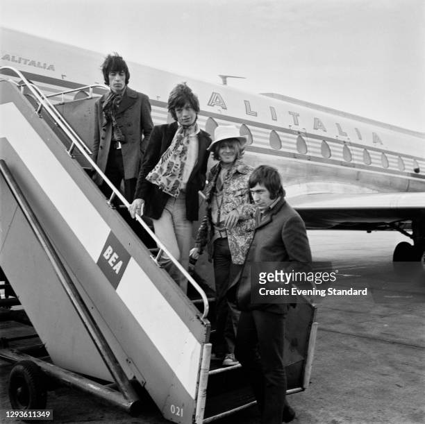 British rock group the Rolling Stones at Heathrow Airport in London, UK, April 1967. From left to right, Bill Wyman, Mick Jagger, Brian Jones and...