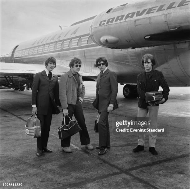 English garage rock band the Troggs at Heathrow Airport in London, UK, April 1967. From left to right, drummer Ronnie Bond, singer Reg Presley,...