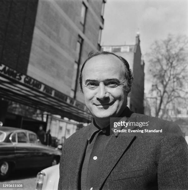 English theatre, opera and film director John Dexter outside the Curzon Mayfair in London, UK, April 1967.