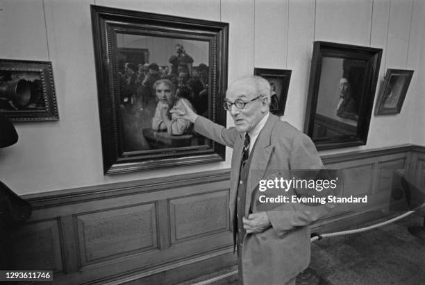 British painter Sir Gerald Kelly presides over a press viewing of the eight stolen paintings recovered by the Dulwich College Picture Gallery in...