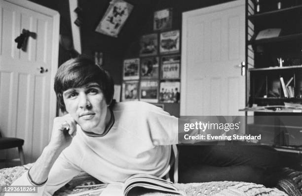 English musician and songwriter Dave Clark of the Dave Clark Five, relaxing in his bedroom, UK, 1966.