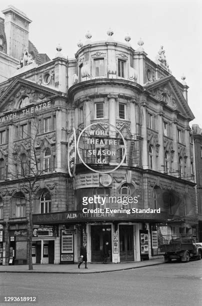 The Aldwych Theatre in the West End of London, UK, April 1966. It is advertising World Theatre Season 66.