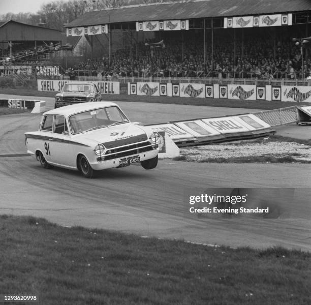 British racing driver Jim Clark driving a Ford Lotus Cortina for Team Lotus at Goodwood, during the St Mary's Trophy Race, UK, 11th April 1966. The...