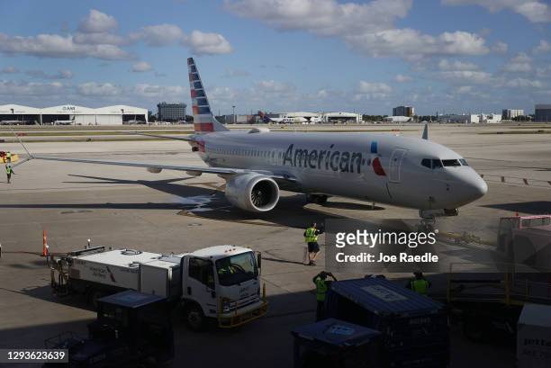 American Airlines flight 718, a Boeing 737 Max, is pushed back from its gate at Miami International Airport on its way to New York on December 29,...