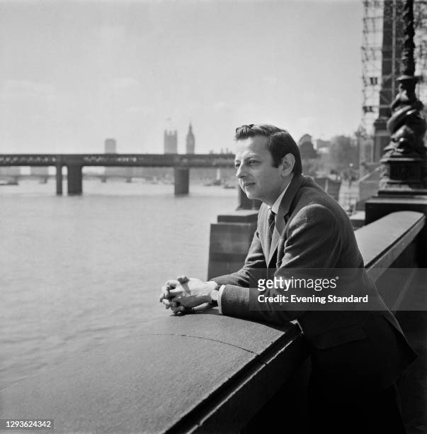 German-American pianist and conductor André Previn on the River Thames in London, UK, 4th May 1966.