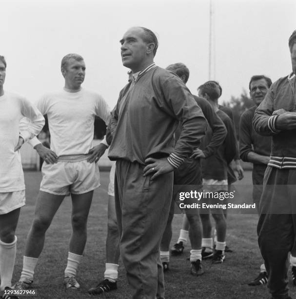 Alf Ramsey , manager of the England team during the World Cup, UK, July 1966. On the left is team captain Bobby Moore .