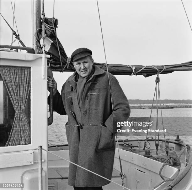 British actor Anthony Quayle on a sailing boat, UK, 20th January 1966.