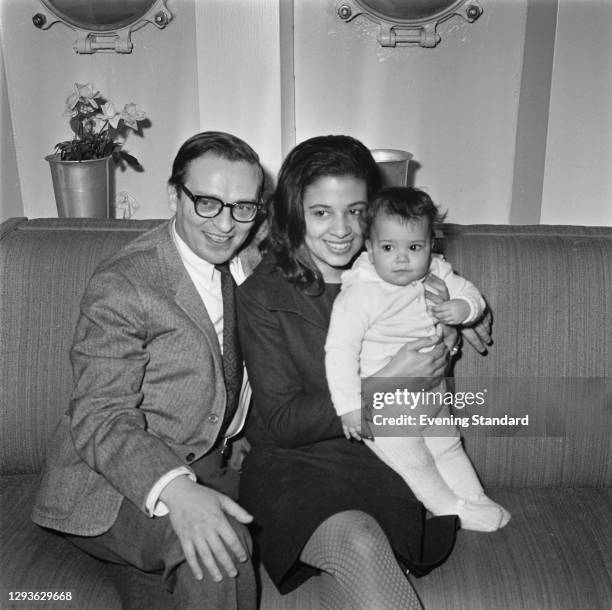 American film director, producer and screenwriter Sidney Lumet with his wife Gail and their baby daughter Amy, UK, 1966. Gail is the daughter of...