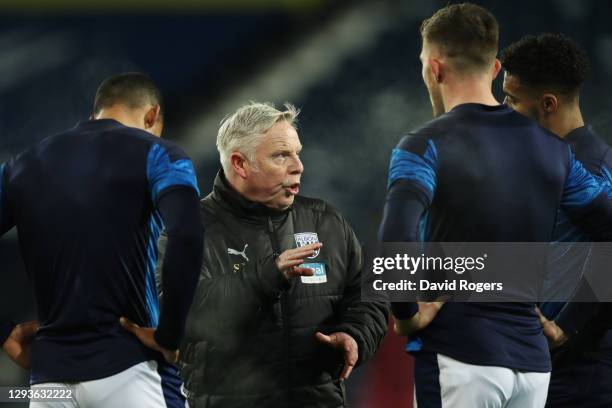 Sammy Lee, First Team Coach of West Bromwich Albion talks to West Bromwich Albion players during the warm up prior to the Premier League match...