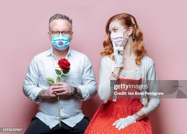 valentine's day - couple in quarantine with ppe masks - coronavirus dating stock pictures, royalty-free photos & images