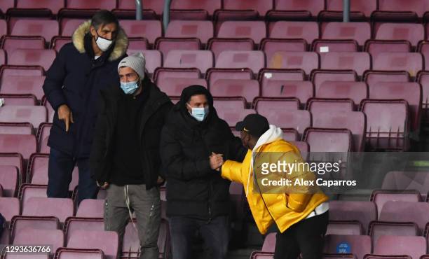 Lionel Messi of Barcelona is seen in the stands greeting Anssumane 'Ansu' Fati during the La Liga Santander match between FC Barcelona and SD Eibar...
