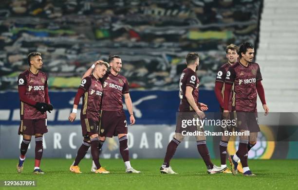 Ezgjan Alioski of Leeds United celebrates with teammate Jack Harrison after scoring their team's second goal during the Premier League match between...