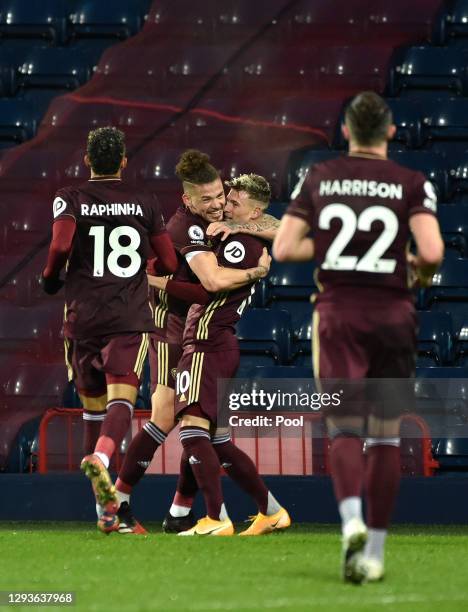 Ezgjan Alioski of Leeds United celebrates with teammate Kalvin Phillips after scoring their team's second goal during the Premier League match...