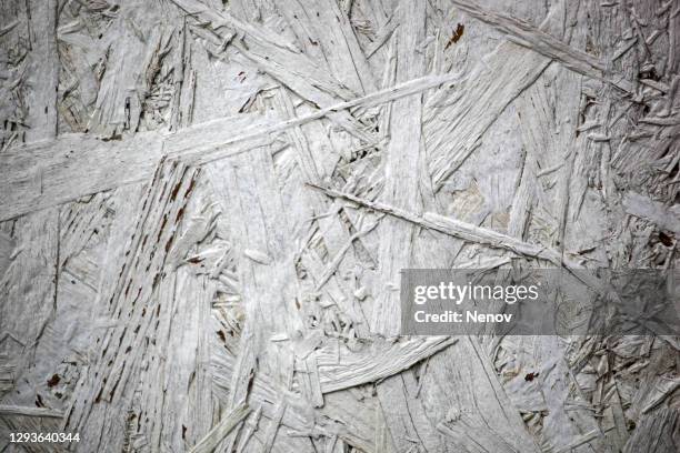 texture of raw chipboard sheet - chips on paper stock pictures, royalty-free photos & images