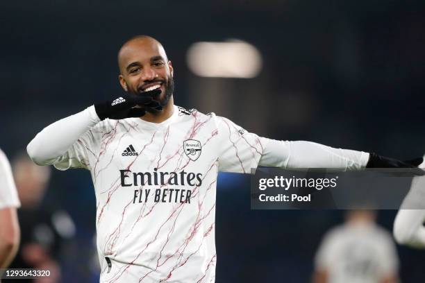 Alexandre Lacazette of Arsenal celebrates after scoring his team's first goal during the Premier League match between Brighton & Hove Albion and...