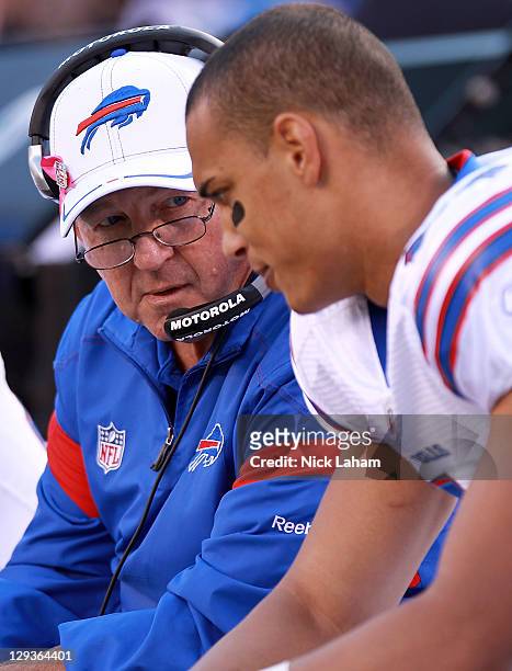 Head coach of the Buffalo Bills, Chan Gailey talks with David Nelson against the New York Giants at MetLife Stadium on October 16, 2011 in East...