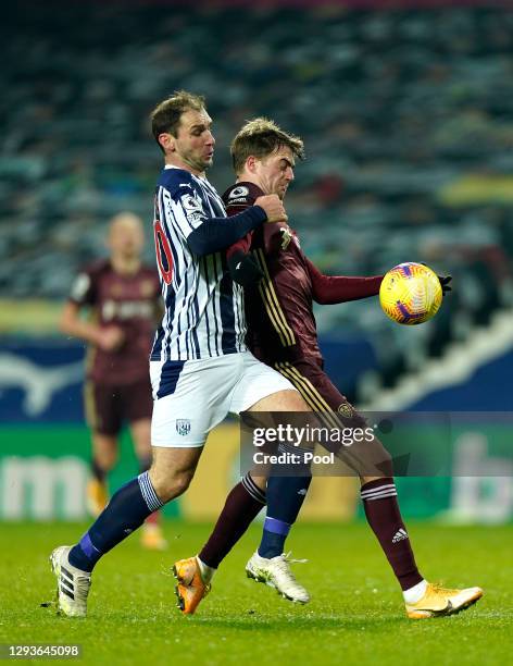 Patrick Bamford of Leeds United holds off Branislav Ivanovic of West Bromwich Albion during the Premier League match between West Bromwich Albion and...