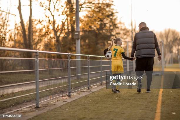 soccer father sports chaperone - kids practicing stock pictures, royalty-free photos & images